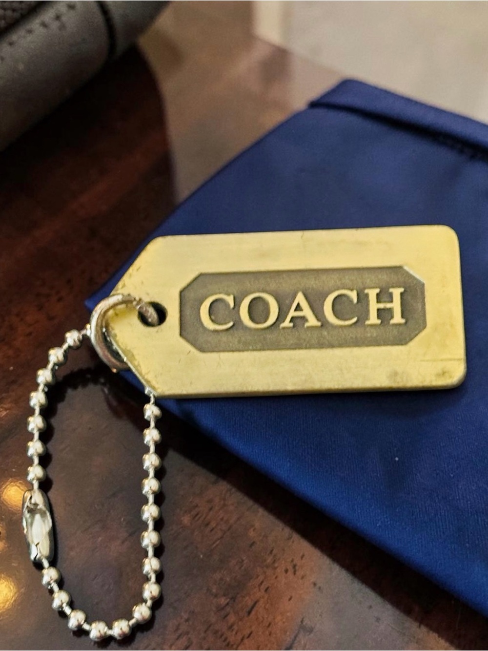 Coach Logo HangTag Keychain In Brass. Bag Accessory